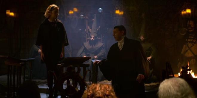 Father Faustus interrogating Sabrina inside the Church of Night